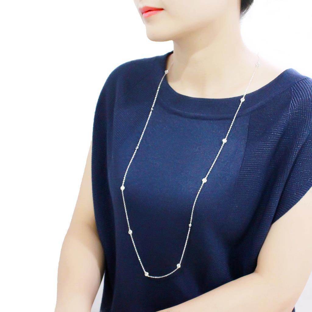 Clear cubic zirconia layered necklace showcased on a model wearing a navy top for a stylish look