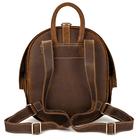 Collapsible travel backpack leather in dark brown with sturdy shoulder straps and top handle for easy carrying