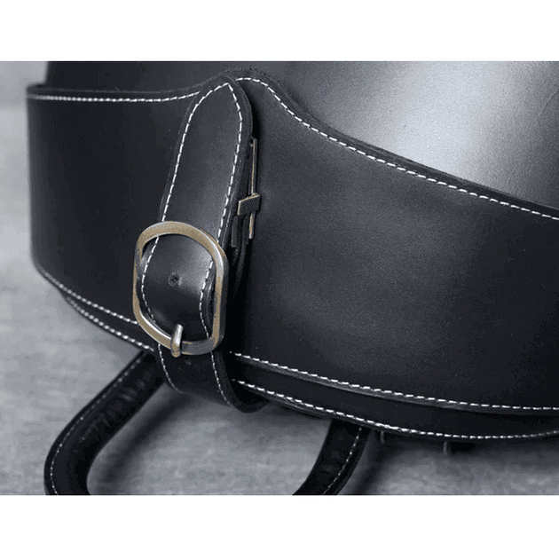 Close-up of a strap buckle on a collapsible travel backpack leather with detailed stitching
