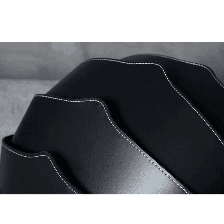 Collapsible travel backpack leather in black with sleek design and durable stitching for easy storage