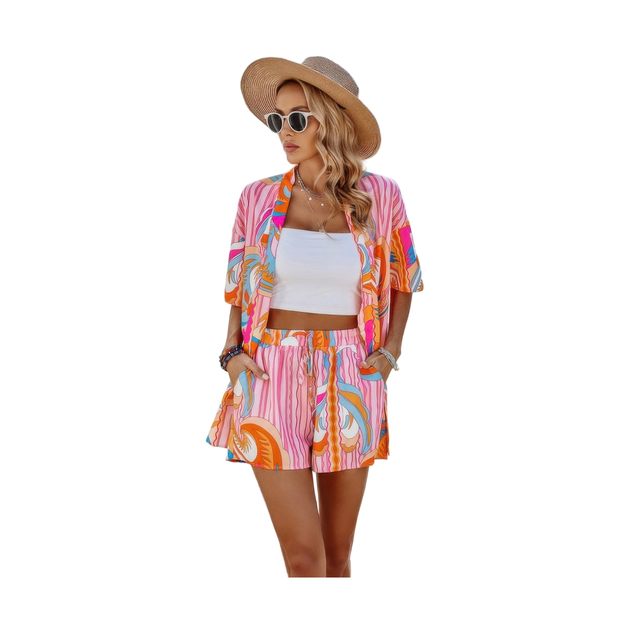 Woman wearing colorful resort wear for women with pink patterned shorts and matching open-front top