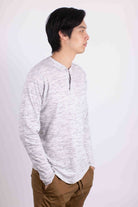 Man wearing a comfortable travel Henley shirt in light gray from Generation XYZ