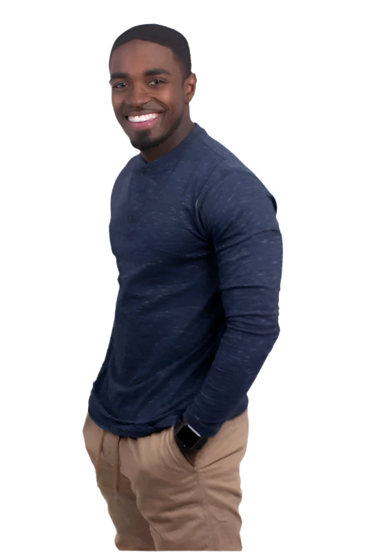 Man wearing a navy blue comfortable travel Henley shirt by Generation XYZ with beige pants