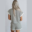 Back view of a woman wearing a comfortable womens travel clothing set with black and white stripes