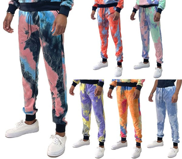 WEIV cotton tye dye sweatpants in various colorful patterns modeled with white sneakers