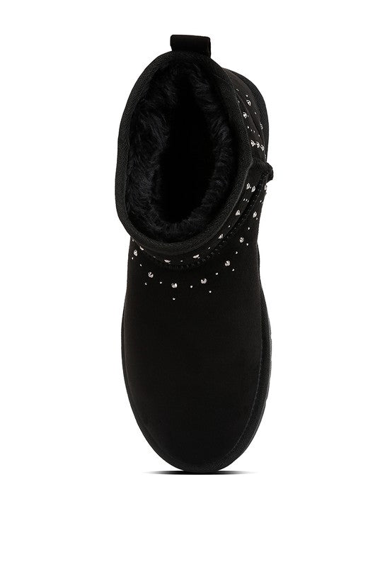 Stylish black cozy fur boots for women featuring decorative studs for a chic look