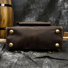 Bottom view of a crazy horse leather backpack 14 inch with brass feet for durability and style