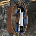 Open view of a crazy horse leather backpack 14 inch featuring organized compartments for laptops and accessories