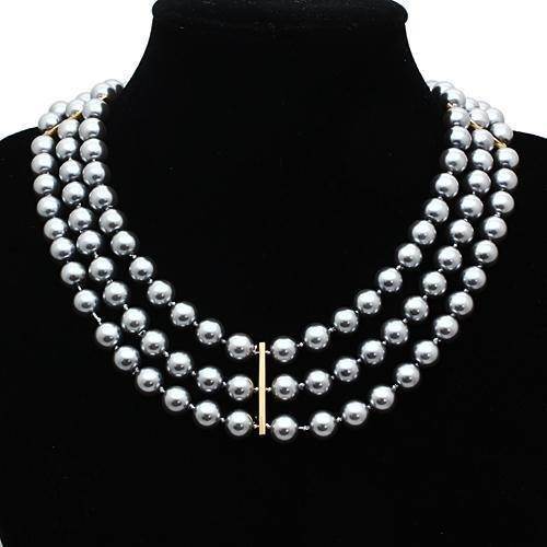 Elegant crown pendant statement jewelry necklace featuring three strands of silver pearls