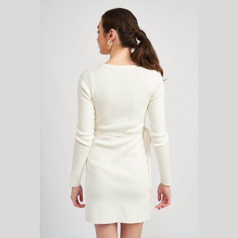 Back view of Emory Park women's cut out detail dress in white with long sleeves and tie detail