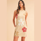 SHEWIN INC. Daisy print tank dress in beige with colorful floral patterns and pockets