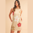 SHEWIN INC. Daisy print tank dress with a light beige background and colorful floral patterns