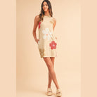 Stylish women's Daisy print tank dress in beige with colorful floral patterns and side pockets