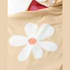 SHEWIN INC. Daisy print tank dress featuring a large floral design in soft colors