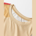 Close-up of a beige women's dress neckline highlighting the comfortable fabric of a daisy print tank dress
