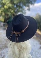 Stylish black dandy panama hat vacation with a decorative leather band for sunny getaways