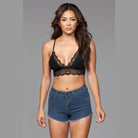 VacationGrabs women's high waisted denim shorts with frayed hem styled with black lace bralette