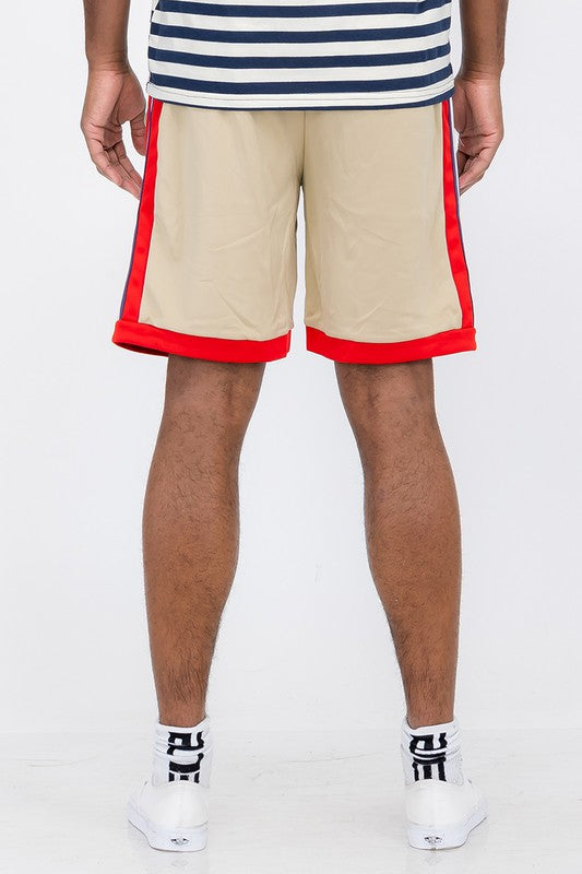 Back view of Double O Tape casual sweat shorts in beige with red side and bottom trim worn by a male model