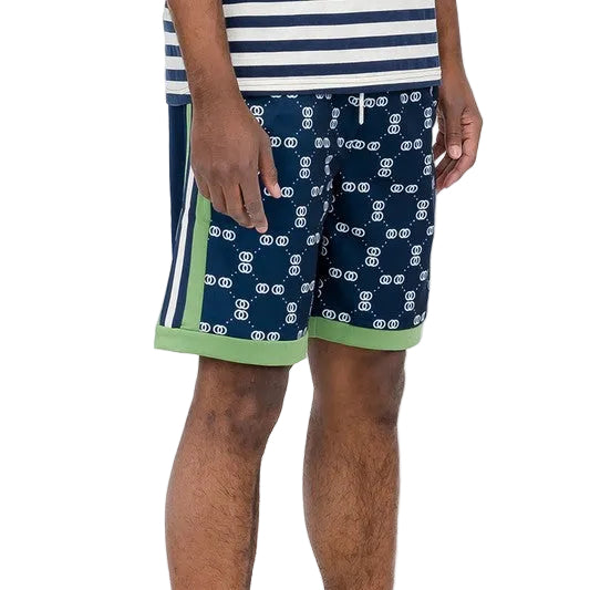 Double O Tape casual sweat shorts in navy blue with white pattern and green trim on model