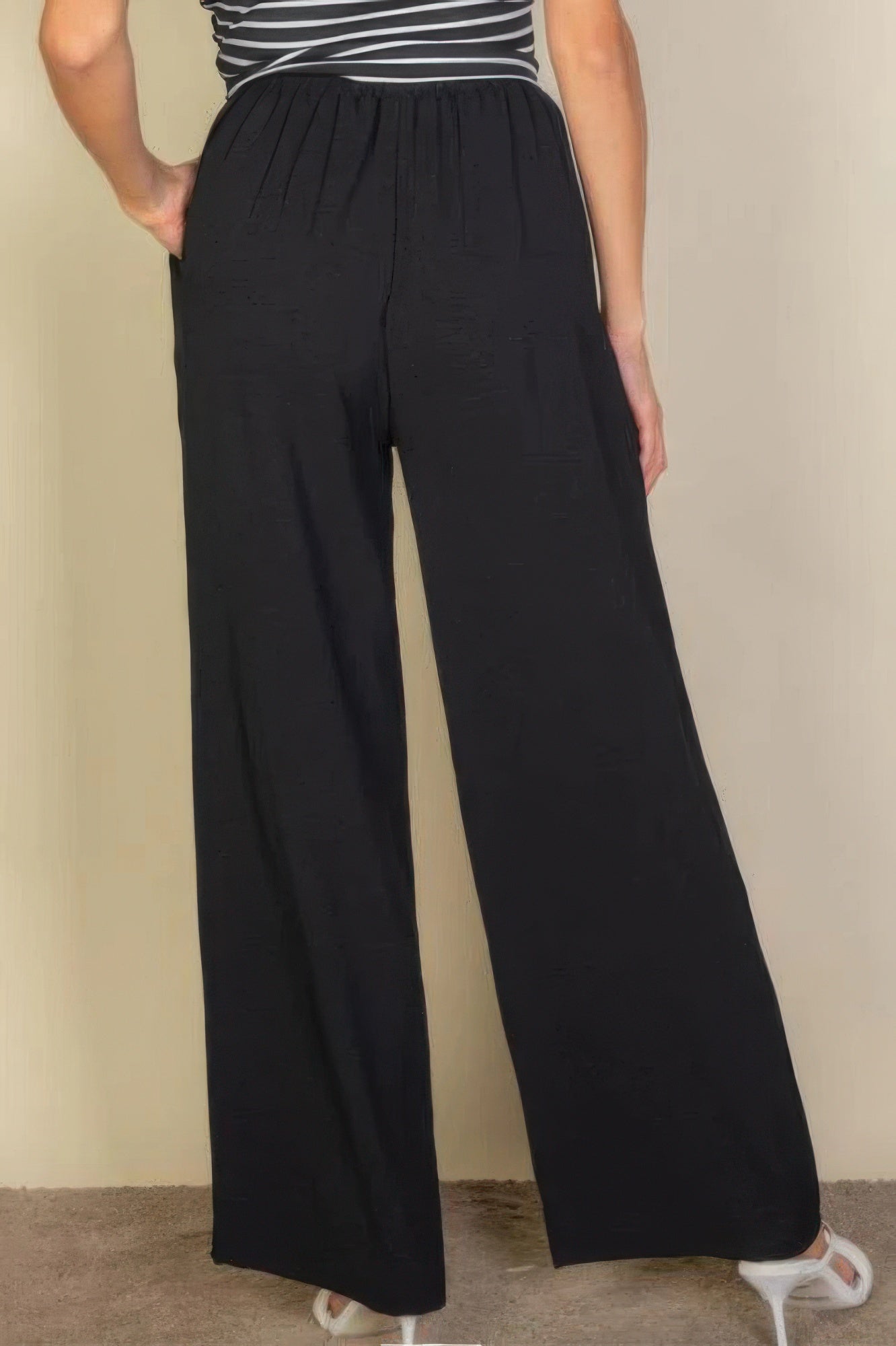 VacationGrabs women's black drawstring waist wide leg pants shown from back with relaxed fit