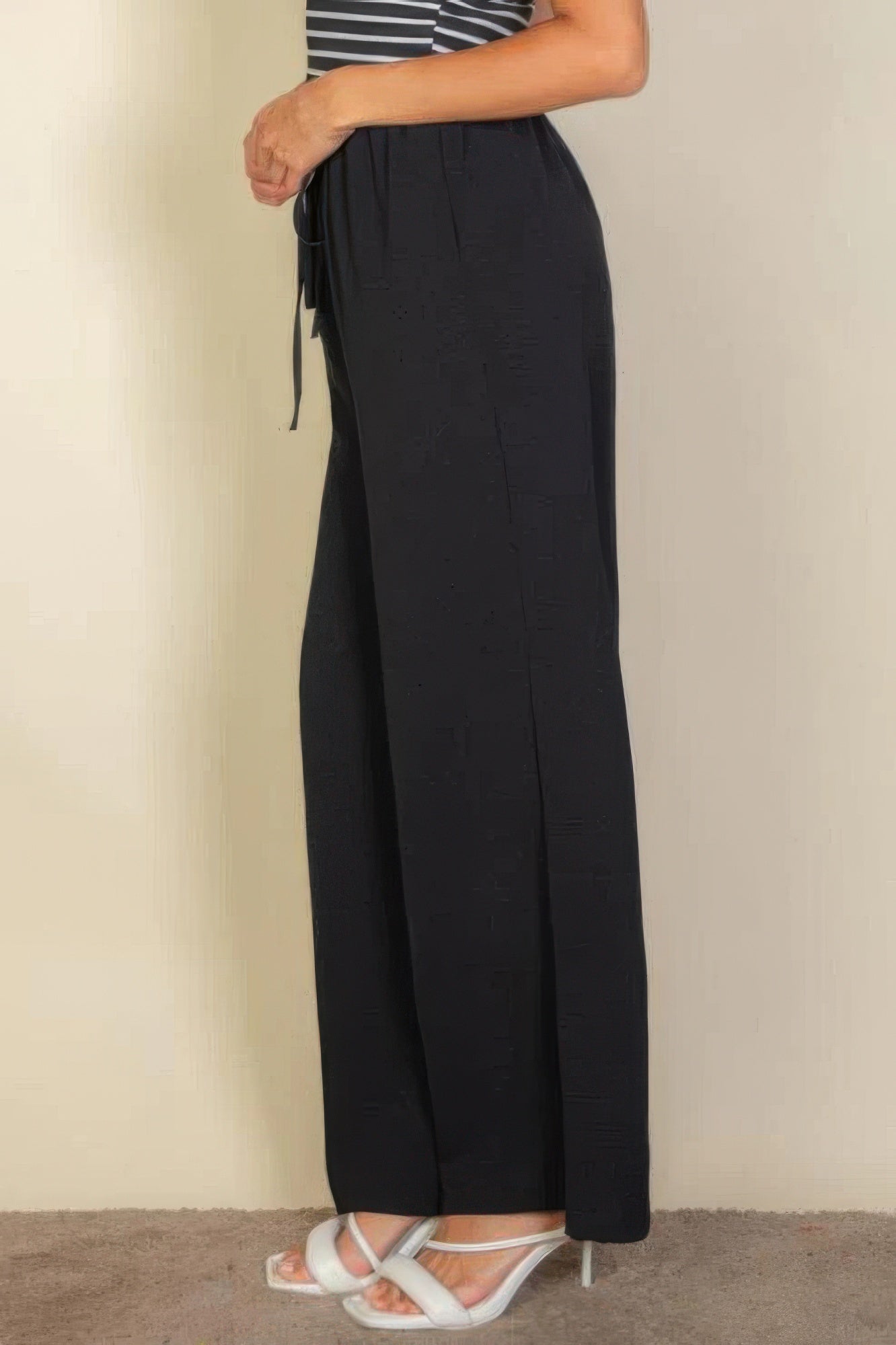 VacationGrabs women's black drawstring waist wide leg pants styled with white heels