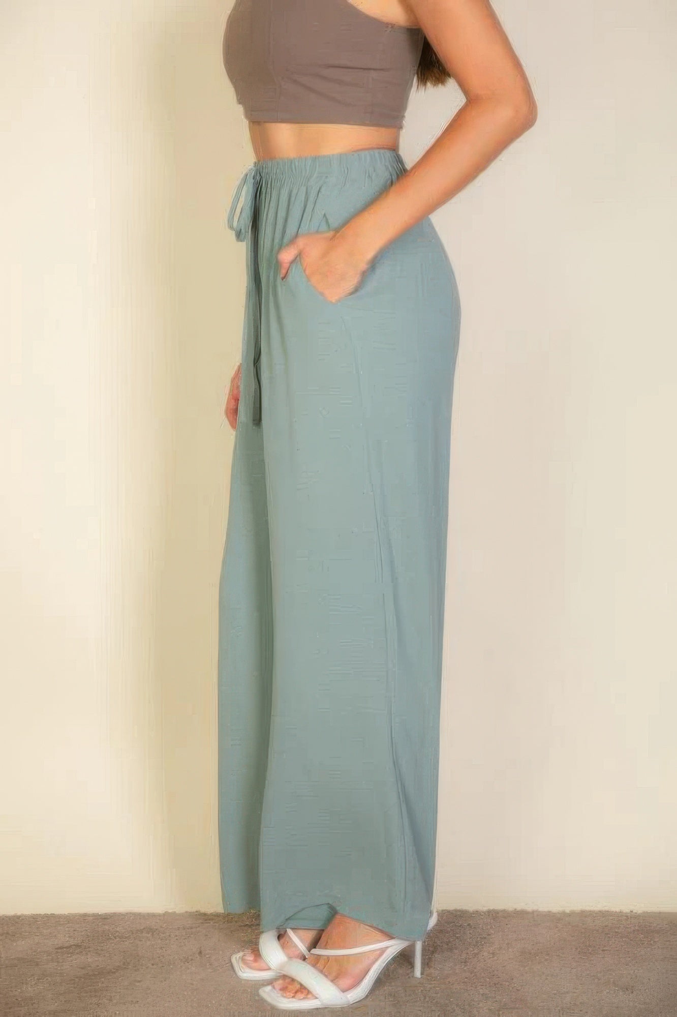 VacationGrabs women's drawstring waist wide leg pants in light blue with pockets styled with a cropped top and heels