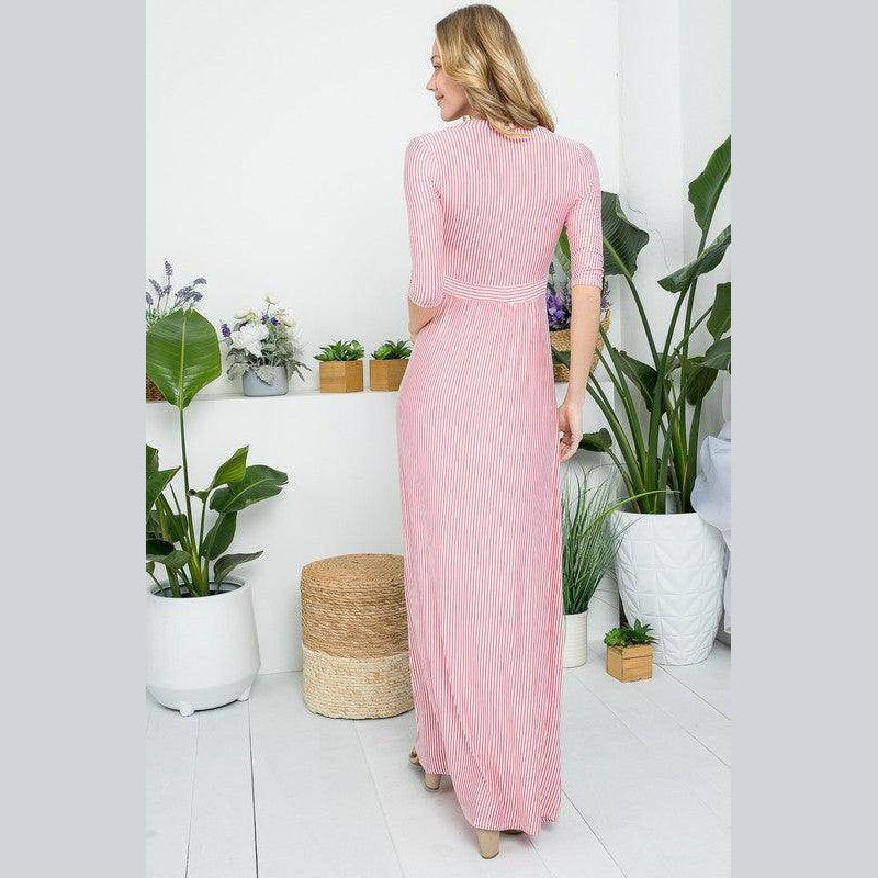 Back view of a dusty pink maxi dress by e Luna featuring a ribbed design and elegant silhouette