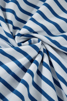 Close-up of fabric showing striped drop shoulder sweatshirt in blue and white colors