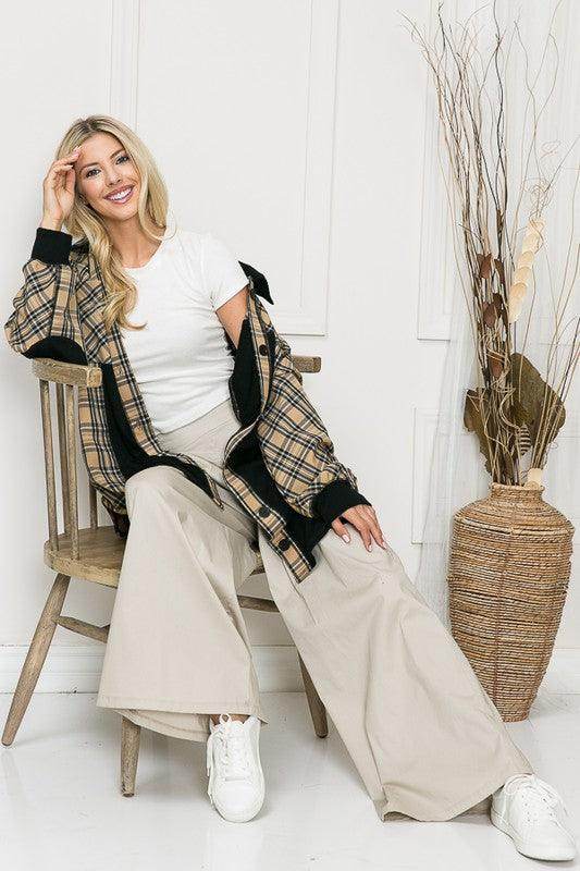 Stylish women's elbow patch shacket shirt in plaid pattern, paired with beige wide-leg pants