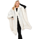 VacationGrabs white knit faux fur trim cape for women modeled over black outfit stylish winter coat