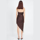 Back view of an elegant summer dress by Emory Park in rich brown with a stylish asymmetrical hemline