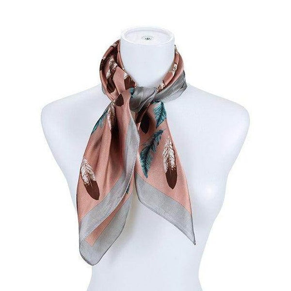 Bella Chic elegant travel scarves in soft pink with feather prints, perfect for stylish travel accessories