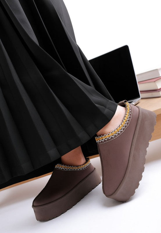 Rag Company embroidered platform slip-on shoes styled with a pleated black skirt for a fashionable look
