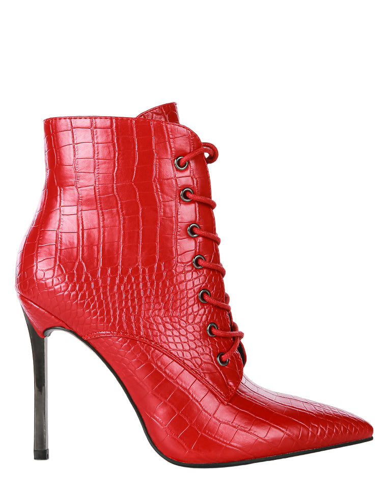 Red high-heeled ankle boot with crocodile texture on a white background