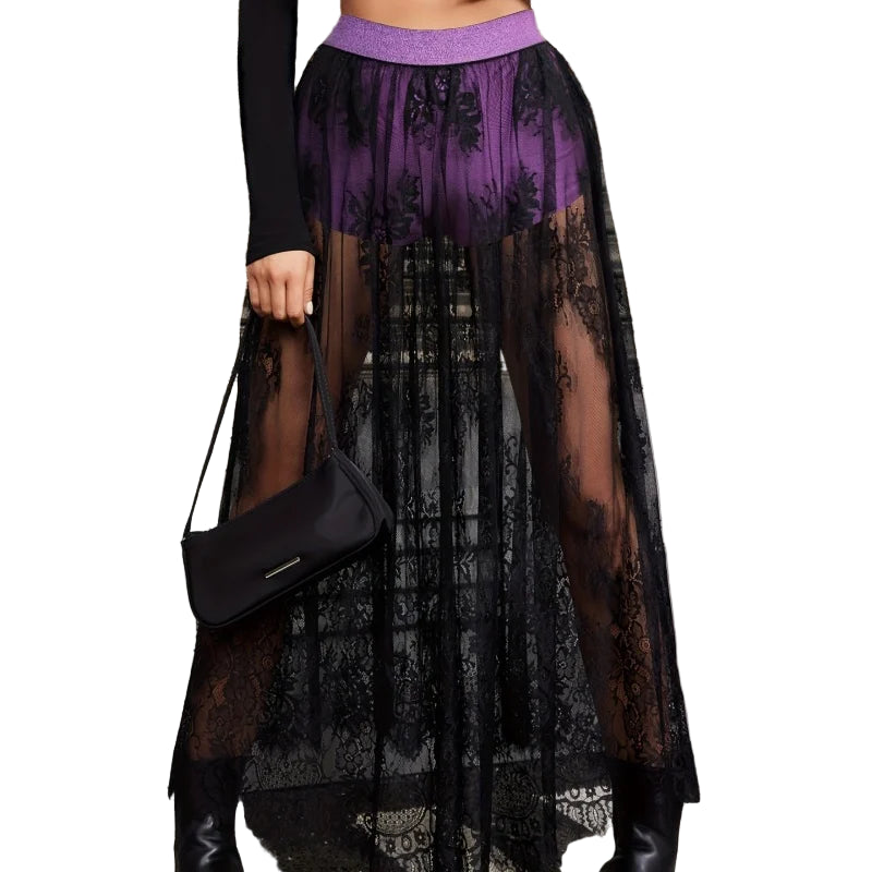 Black sheer lace skirt with shorts featuring floral patterns and a purple waistband worn with black top and boots