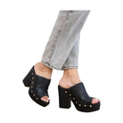 Black platform fashion heels for vacation outfits with studded details on women's sandals