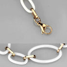 Elegant VacationGrabs fashion jewelry for women featuring a stylish gold clasp and white links