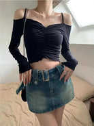 Black off shoulder crop top for women with ruched detail paired with denim mini skirt