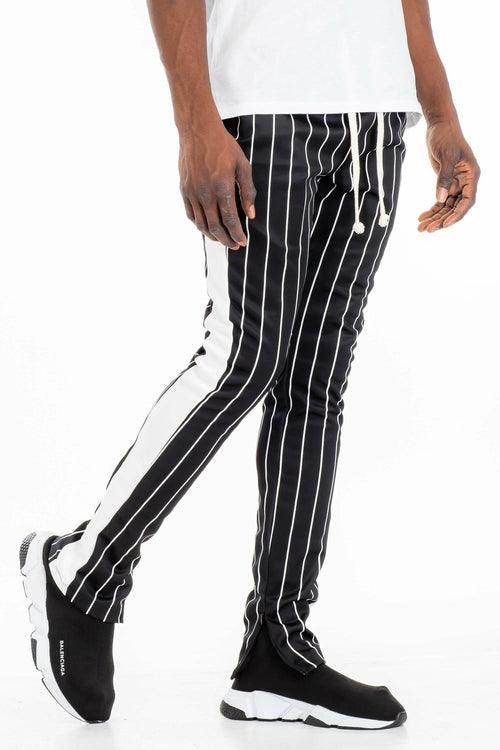 Men's fashion track pants in black and white stripes for a stylish vacation style look
