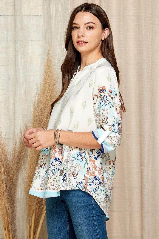Shopin LA women's floral roll up sleeve top with vibrant floral patterns and lightweight fabric