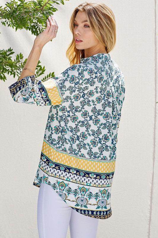 Women's floral roll up sleeve top in vibrant colors with a stylish design from Shopin LA