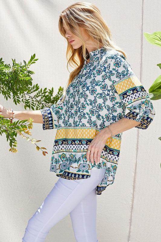 Shopin LA floral roll up sleeve top in vibrant colors, perfect for a stylish casual look
