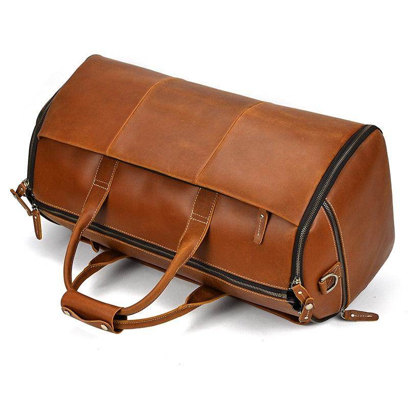 VacationGrabs foldable leather suit bag in brown with sturdy handles and zip closure for travel