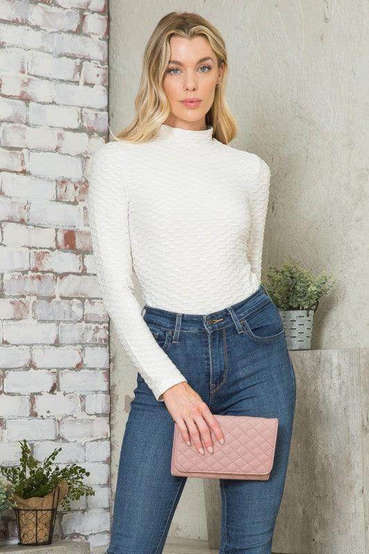 Andante USA Women's form-fitting travel bodysuit in white, perfect for stylish travel outfits