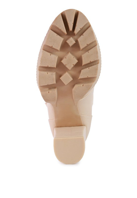 Bottom view of Rag Company fur lined heeled boots with durable traction sole for grip and stability