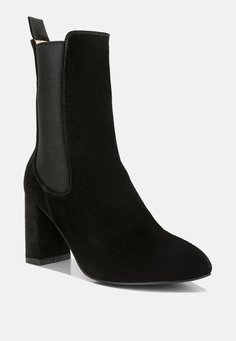 Black ankle boot with block heel on a white background