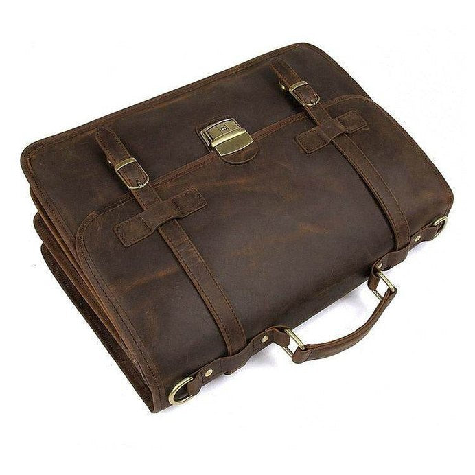 Classic brown genuine leather business bag with sturdy handle and buckles for professional use