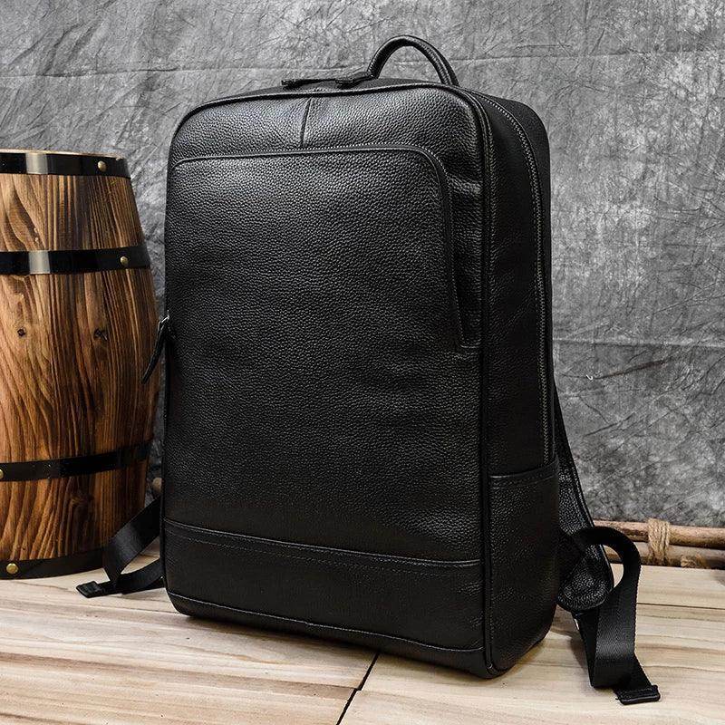 Genuine leather laptop backpack in black with a sleek design for professional use