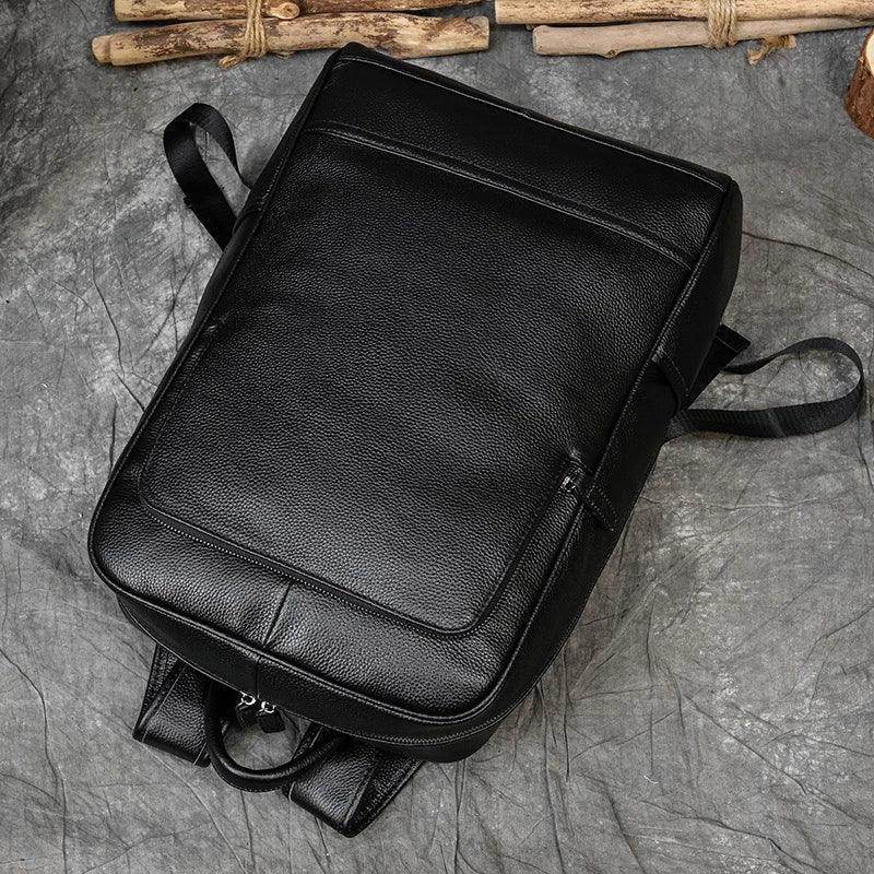 VacationGrabs genuine leather laptop backpack with multiple pockets and a sleek black design