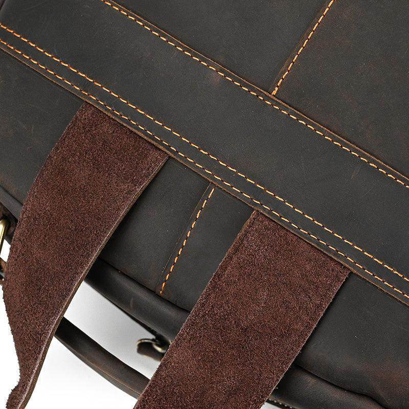 Close-up of a genuine leather laptop backpack showing premium stitching and durable straps
